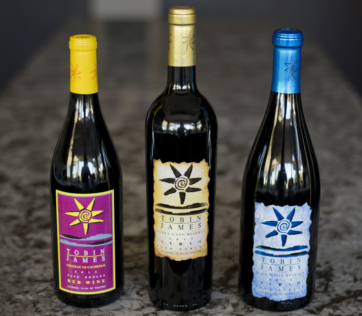 Tobin James’ Accessible, Stretch, and Aspirational ladder rungs (featured left to right): Le Cacheflo, James Gang Reserve Syrah, and Blue Moon Reserve Syrah.